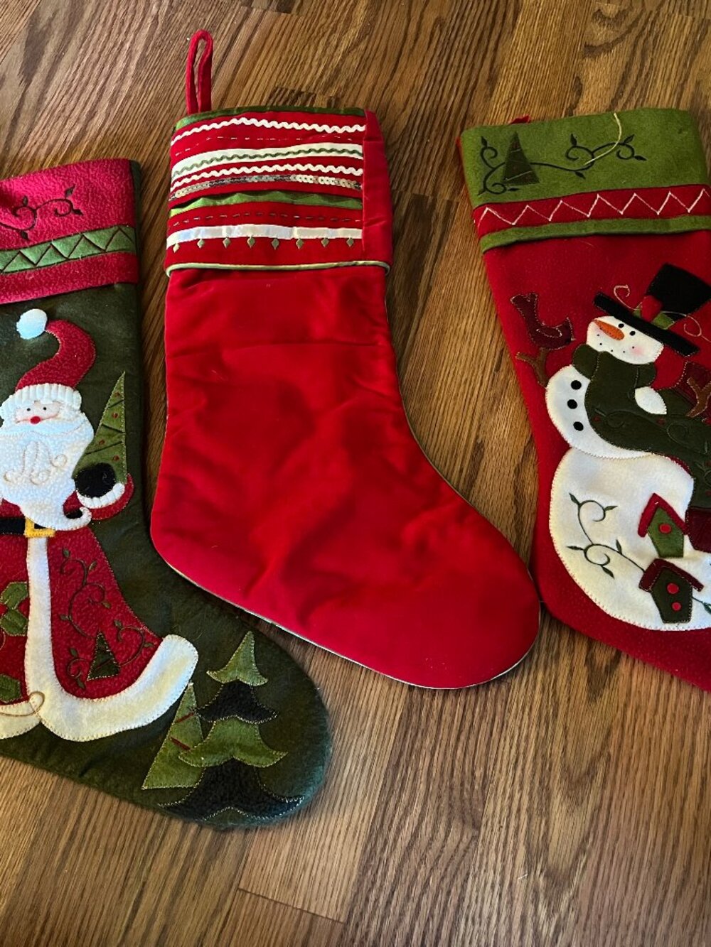 3 Christmas stockings and Santa hat